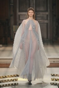 Iris van Herpen Seijaku couture creation inspired by cymatics and sound waves, with hand-blown glass bubbles coated in silicone forming bioluminescent patterns.