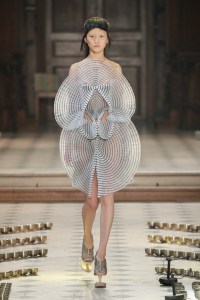 Iris van Herpen Seijaku couture creation inspired by cymatics and sound waves, with hand-blown glass bubbles coated in silicone forming bioluminescent patterns.