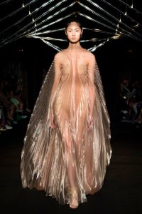 Iris van Herpen Syntopia collection dress inspired by bird flight and kinetic installations, crafted with laser-cut organza and intricate weaving.