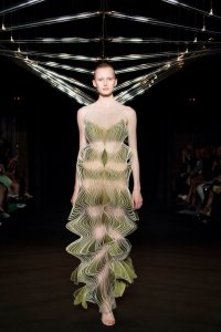 Iris van Herpen Syntopia collection dress inspired by bird flight and kinetic installations, crafted with laser-cut organza and intricate weaving.