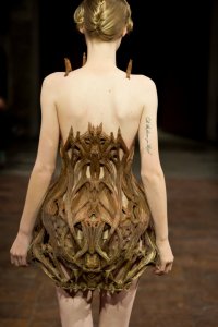 Iris van Herpen Micro collection couture design inspired by microorganisms, featuring microscopic patterns translated into sculptural garments.
