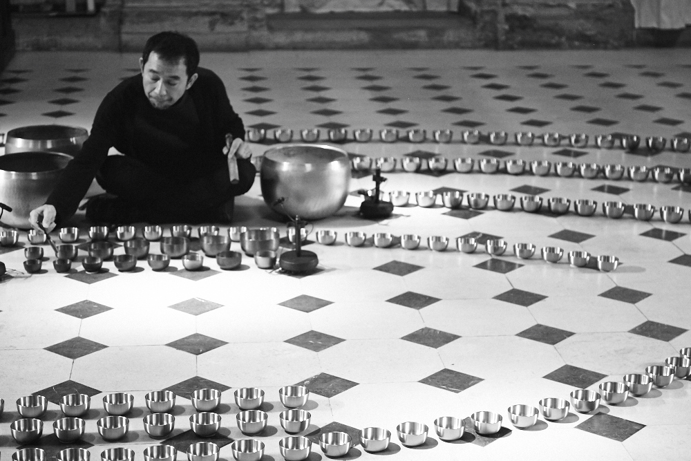 Iris van Herpen Seijaku couture creation inspired by cymatics and sound waves, with hand-blown glass bubbles coated in silicone forming bioluminescent patterns.