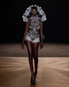 Iris van Herpen Sympoiesis couture gown inspired by symbiosis and marine ecosystems, blending 3D-printed structures with flowing organic fabrics.